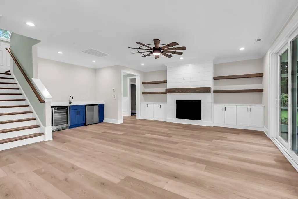 Open living room with built-ins, an example of thoughtful planning to prevent custom home regrets.