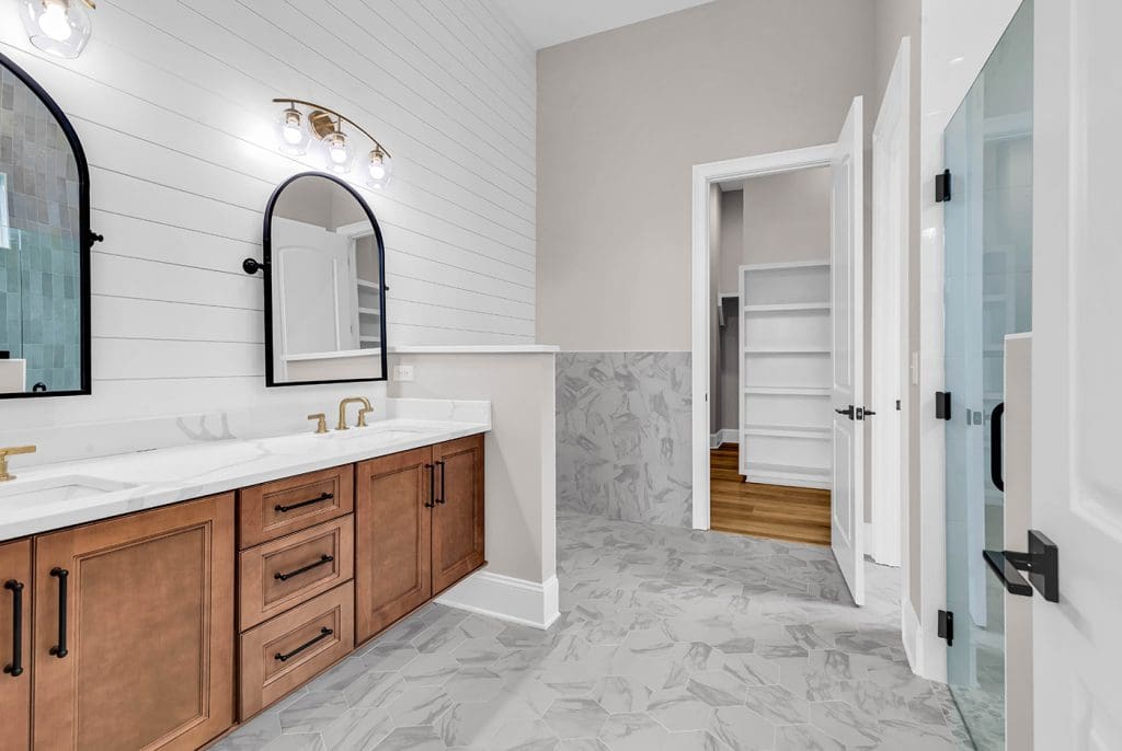 Modern coastal bathroom with wide, open space designed for universal accessibility.