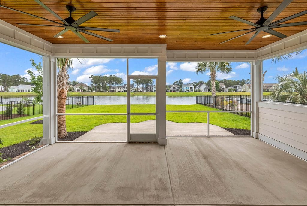 Covered porch with lighting showcasing outdoor living space ideas for year-round enjoyment.