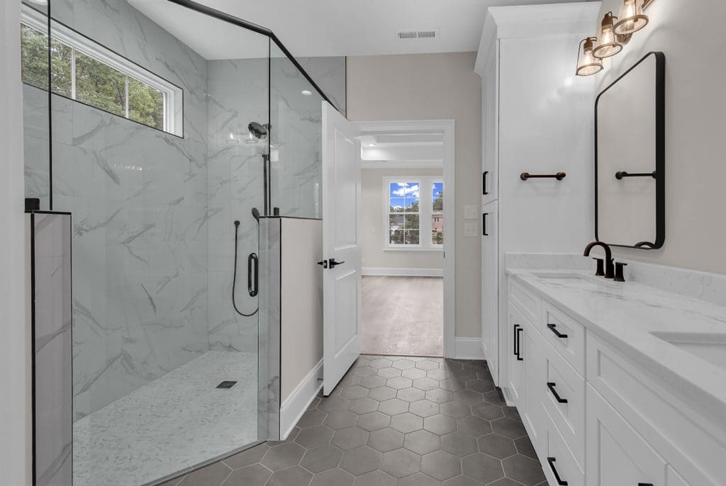 Modern bathroom design that avoids common custom home regrets through smart layout and finishes.