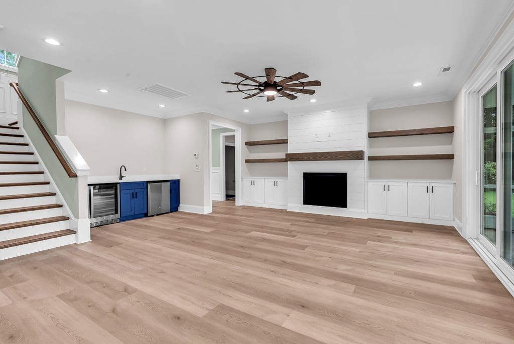 Open living room with built-ins, an example of thoughtful planning to prevent custom home regrets.
