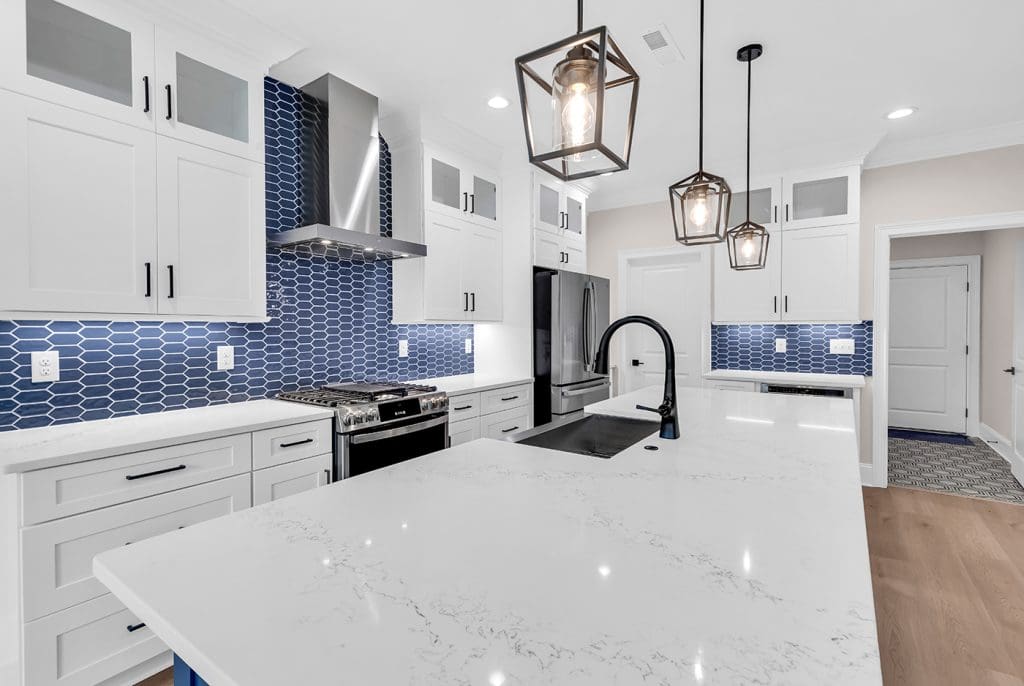 Blue coastal kitchen design illustrating how to simplify choices and reduce custom home decision fatigue.