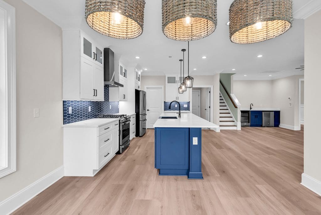 Blue coastal kitchen design highlighting smart choices for building in an uncertain market.