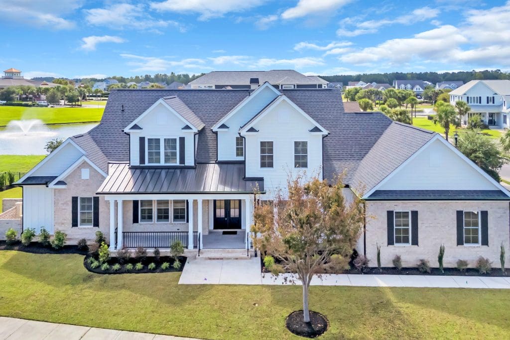 Exterior of a custom home illustrating the importance of timing home sale with new build for a smooth transition.