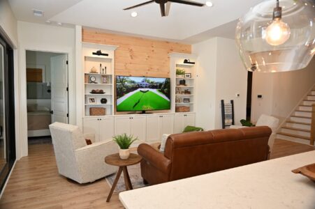 Warm and inviting living area in a modern retirement home, featuring accessible design, cozy seating, and natural light.