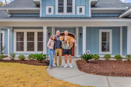 front entrance with family of Tidewater 1 home by swift creek homes