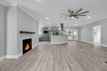 Bright living room and kitchen with open layout showcasing the benefits of first-floor living for seamless daily flow and accessibility.