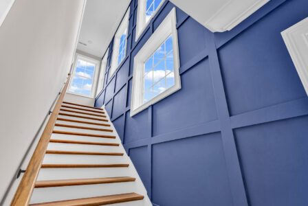 accent wall stairs of Waterbridge home by swift creek homes