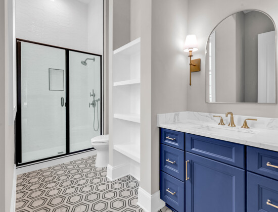 Stylish modern bathroom in a guest suite, designed for comfort and convenience in first-floor living.