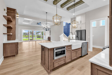 Bright living room and kitchen with open layout showcasing the benefits of first-floor living for seamless daily flow and accessibility.