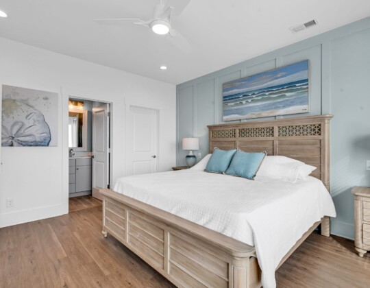 Comfortable bedroom on the first floor illustrating important factors in how to choose a floor plan for accessible and convenient living.