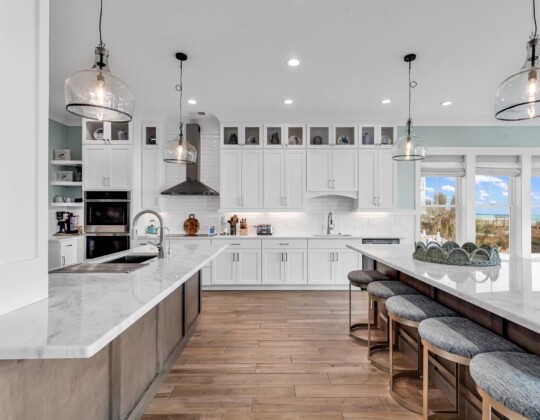 Modern coastal kitchen featuring extensive storage as one of the overlooked custom home upgrades homeowners appreciate most.