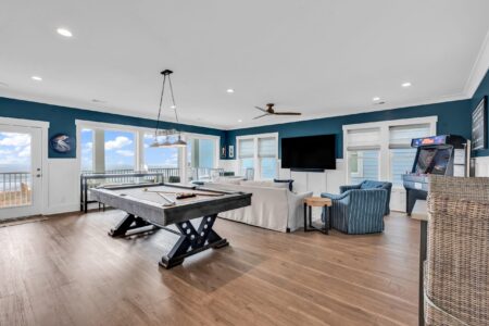 game room and loft of S Ocean home by swift creek homes