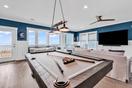 game room and loft of S Ocean home by swift creek homes
