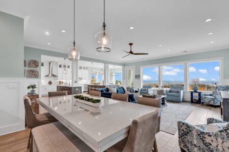 Furnished coastal home with open dining, living, kitchen, and breakfast nook showcasing how to choose a floor plan.