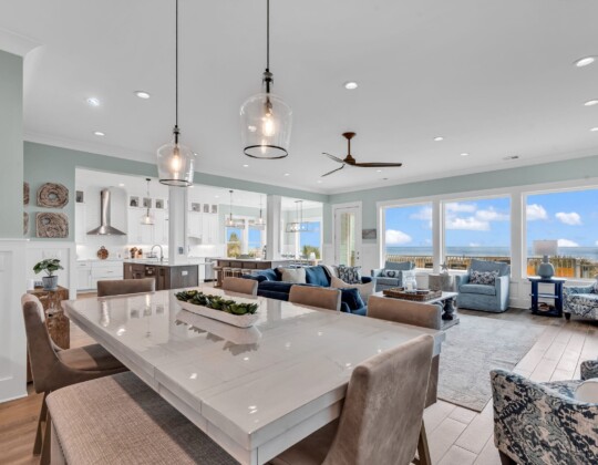 Furnished coastal home with open dining, living, kitchen, and breakfast nook showcasing how to choose a floor plan.