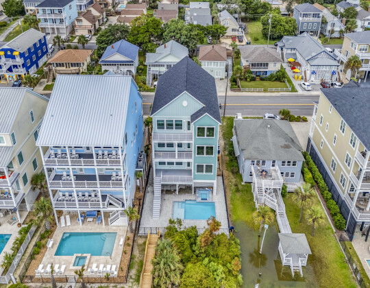 default Oceanfront coastal custom homes along the Myrtle Beach shoreline, featuring elevated designs, private beach access, and durable construction—illustrating key factors that influence the cost of building on the Grand Strand.