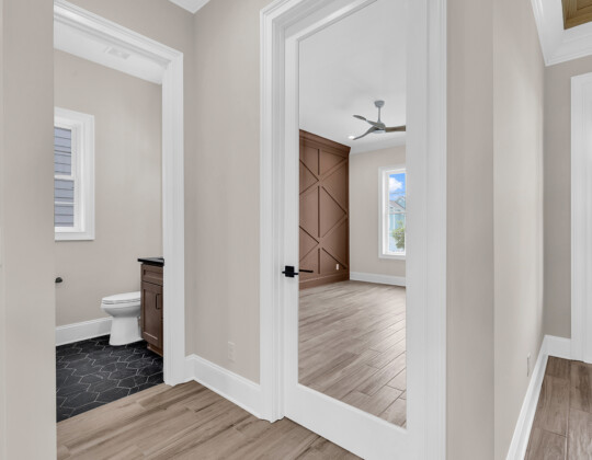 powder bathroom and office entry of Whispering Winds home