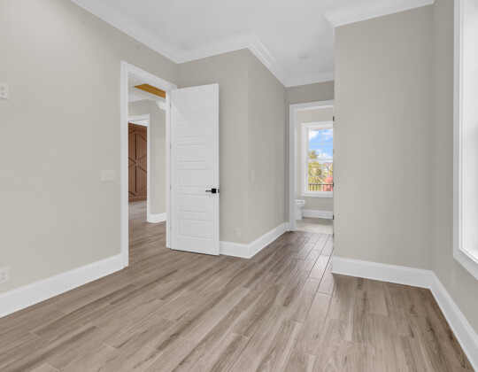 guest bedroom and ensuite bath of Whispering Winds home