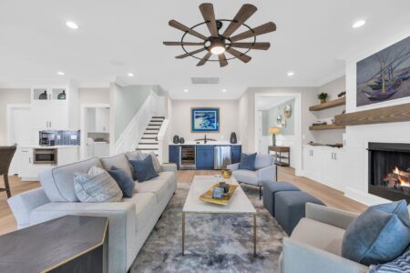 Spacious open-concept living room in a CAPS-certified luxury custom home built by Swift Creek Homes in Myrtle Beach, featuring wide doorways, seamless flow between living spaces, and coastal-inspired finishes