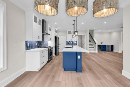 Blue coastal kitchen design highlighting smart choices for building in an uncertain market.
