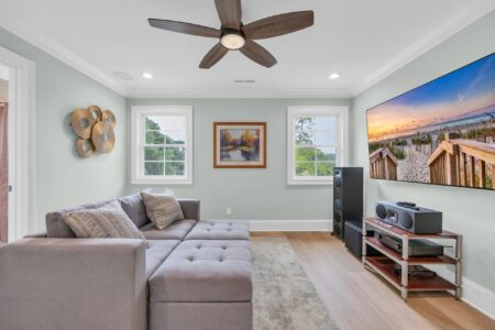 Bright, open loft in a custom aging-in-place home featuring hardwood-style flooring, wide pathways, and abundant natural light — built by Swift Creek Homes along the Grand Strand.